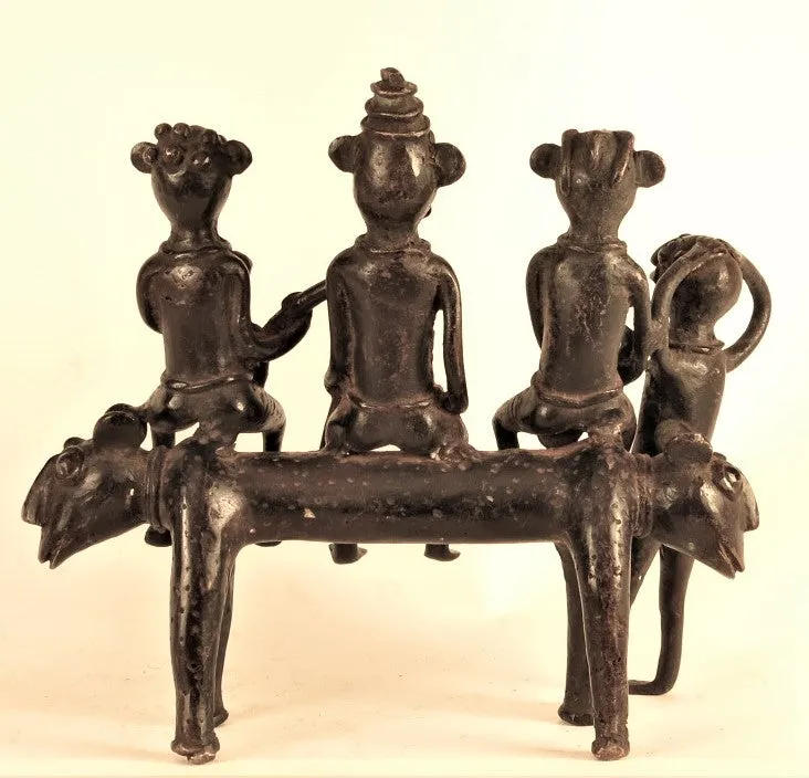 A king and two ladies on a two-headed beast